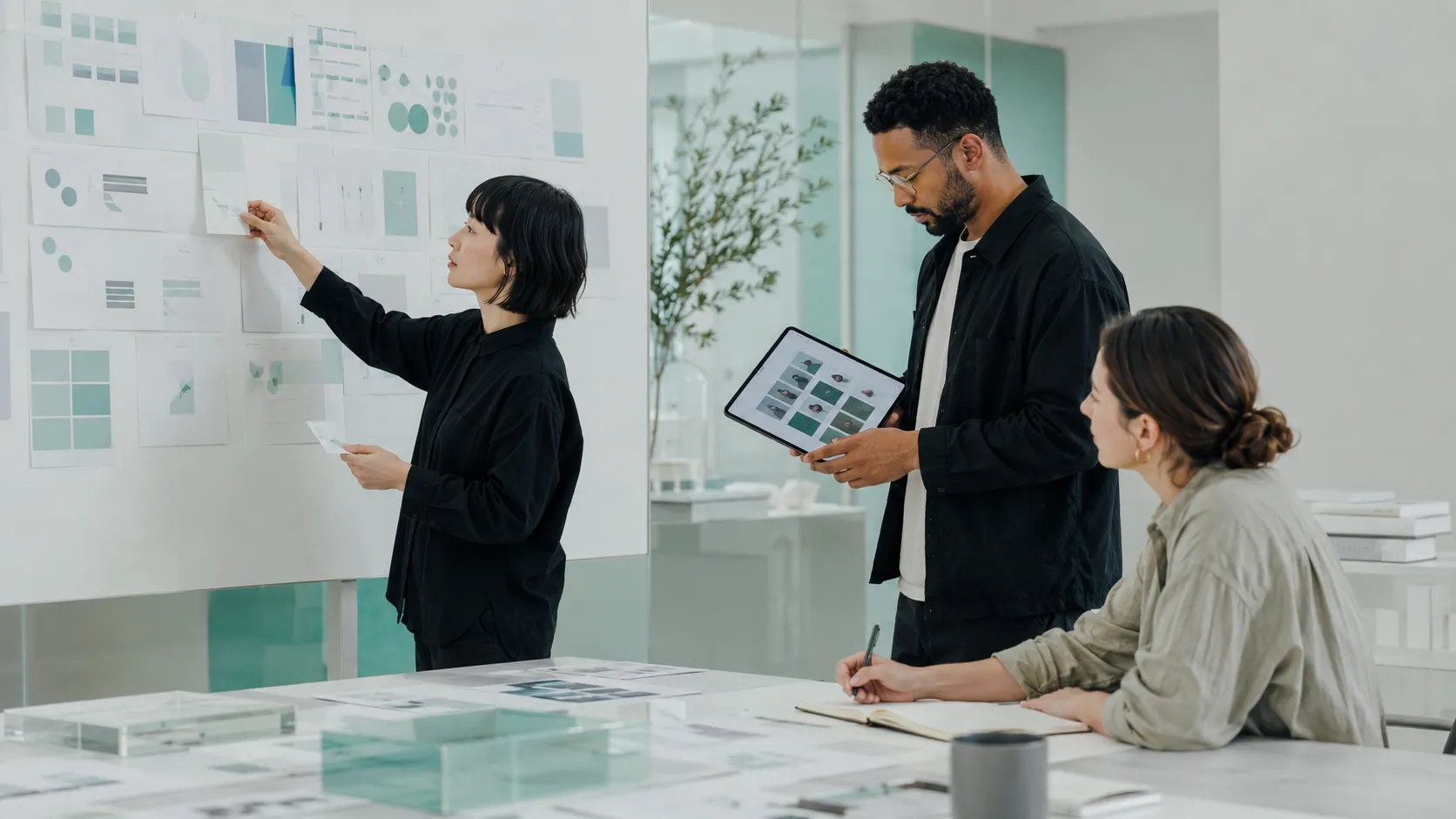 The AI Creators team collaborating on a project in the office